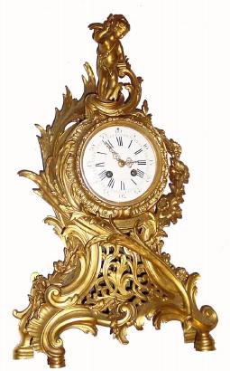 C.1875 French, gilt bronze mantel clock, 8-day time/strike, surmounted by cupid. — Antique Clocks Price Guide
