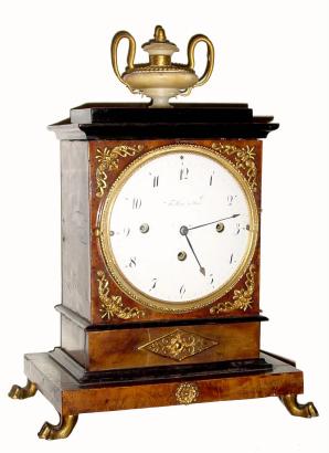 C.1810, Austrian, Fertbauer in Wien, Grand Sonnerie mantel clock, an attractive walnut veneered case with delicate applied ormolu trim, surmounted by an alabaster urn with 2 serpent accents. — Antique Clocks Price Guide
