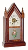 C.1885, E. N. Welch Manufacturing Co., Forestville, Conn, 30-hour time/alarm rosewood and mahogany miniature steeple clock. 