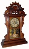 C.1890, Seth Thomas ÓBALL TOPÒ Eclipse style walnut gingerbread, 8-day, time, strike and alarm. 