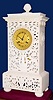 C.1840, French, Pons, Empire Style Mantel clock, case of carved and pierced white alabaster, the pendulum a cast and chased butterfly, showing thorough the piercing. 