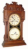 C.1912, Waterbury Clock Co., ÒCalendar No. 43Ó, Ò double dial perpetual calendar, in oak. 