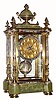 C.1890, French, Enameled Brass and Glass mantel clock with green onyx top and base, and with portrait pendulum (signed). 