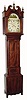 C.1840, English, 8-Day Painted Dial tall clock, with a mahogany veneer case with inlay around the door and on the base and underneath the center finial, and with fluted columns and bracket feet. 