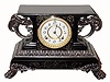 C.1904, Ansonia ÓBELGIUMÒ, iron cased mantel clock with two large winged griffins, 8-day time and strike. 