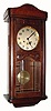 C.1915, German, Westminster Box clock, 8-day quarter chime wall clock, mahogany case with a large 7 beveled pane insert in the door and applied carving. 