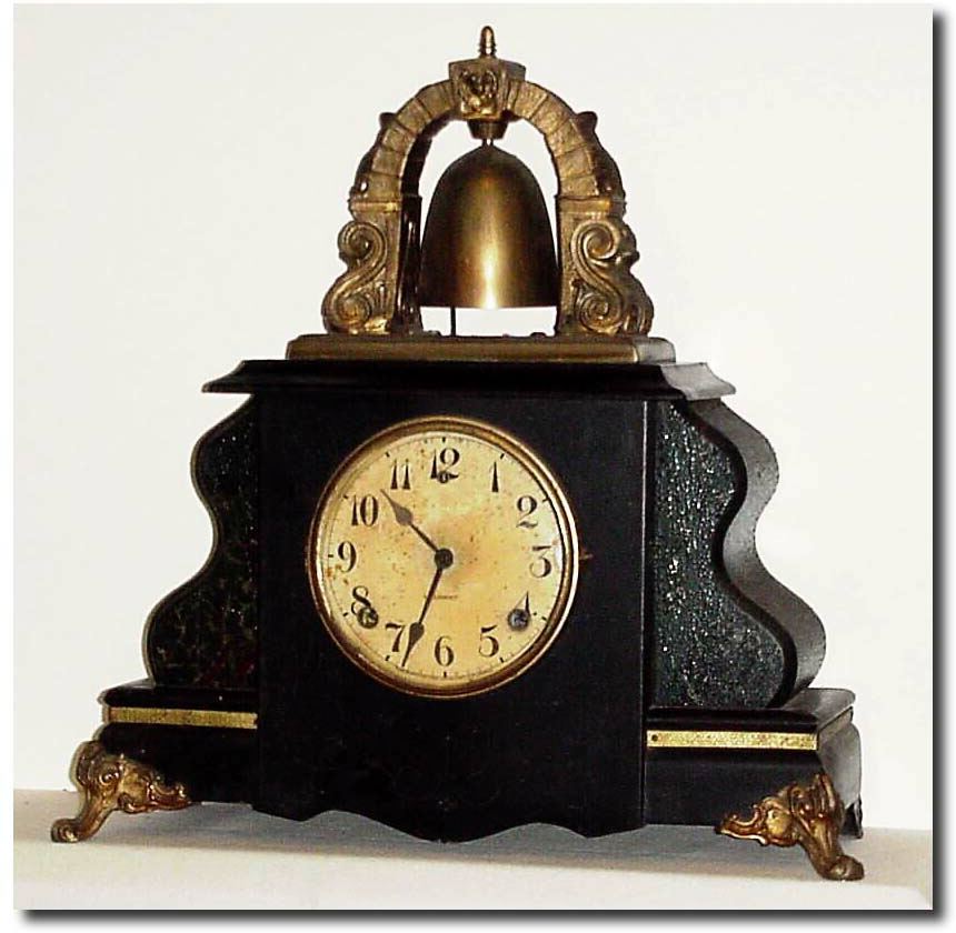 C.1920, Wm.L. Gilbert "Curfew', as-found, less back, crystal and pendulum. — Antique Clocks Price Guide