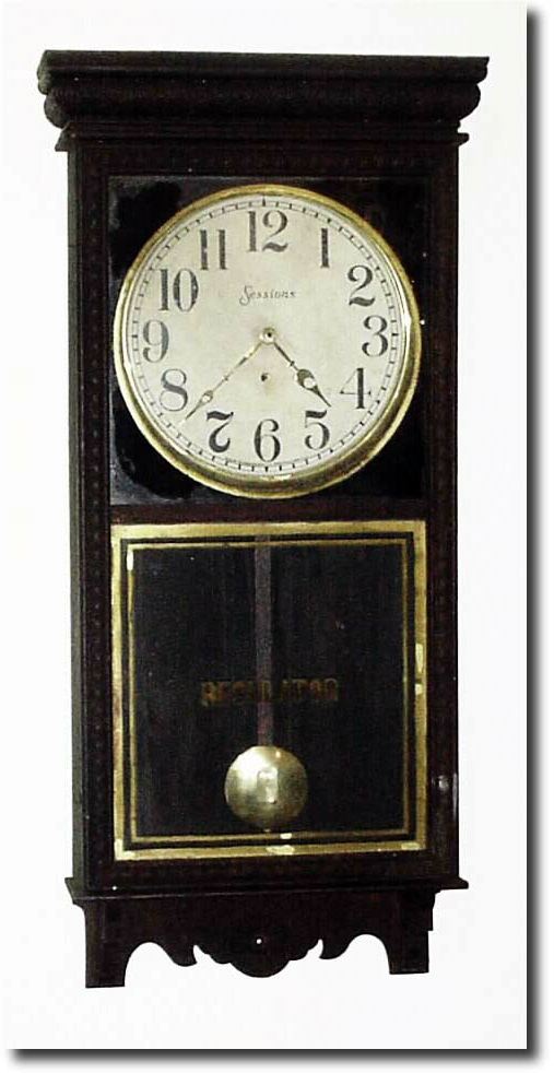 C.1915, Sessions "Regulator E', pressed oak store regulator with original grungy finish intact; has popular "star" pattern in door. — Antique Clocks Price Guide