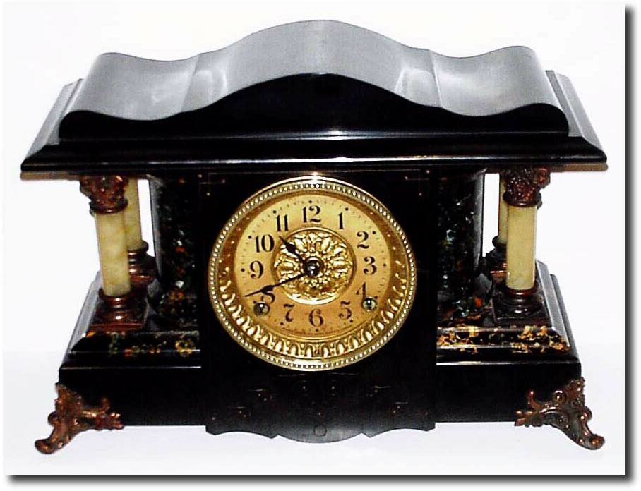 C.1900, Seth Thomas Adamantine mantel clock This is the large model with serpentine top and rounded ends. — Antique Clocks Price Guide
