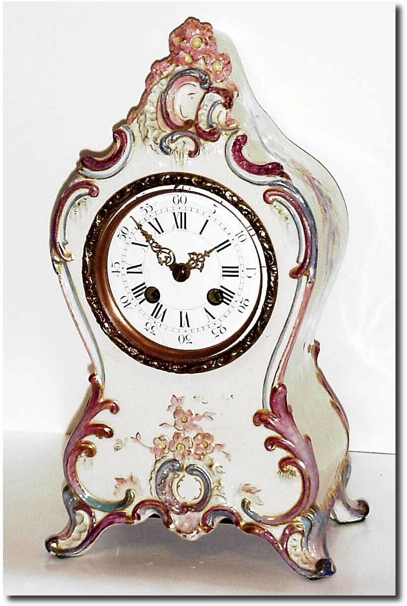 C.1900, French, a Porcelain China Clock in beige with saccents in rose pink and light blue. — Antique Clocks Price Guide