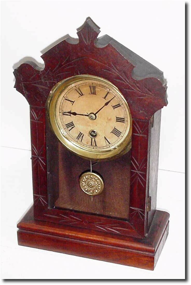 C.1870, Terry Clock Co, small walnut cottage clock, the front door scalloped and incised like a larger walnut parlor clock. — Antique Clocks Price Guide