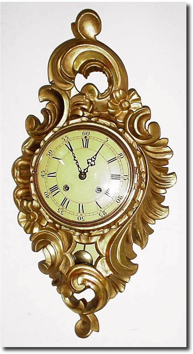 C.1950, Sweden, Ljungstrems Urinderal-fabrik, gilt wood cartel clock in the French style, with "Westerstrand' on the well painted convex dial (dial is painted yellow). — Antique Clocks Price Guide