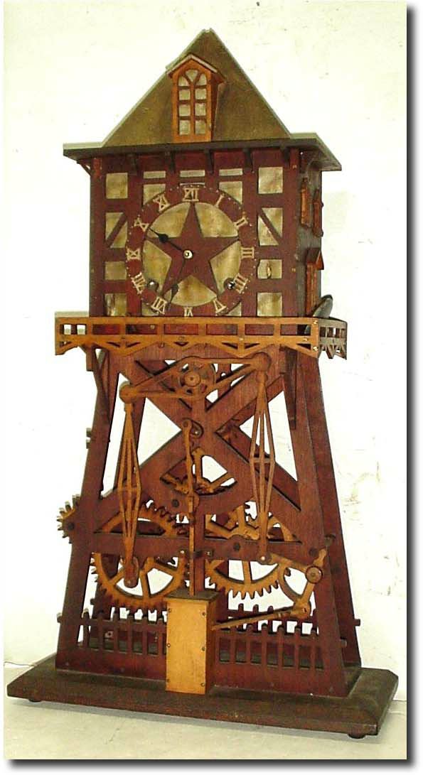 Mixed lot: an incomplete Seth Thomas move-ment (strike train missing), now in a craft project clock with a home-made wooden geared pump with governor assembly in a derrick style case. — Antique Clocks Price Guide