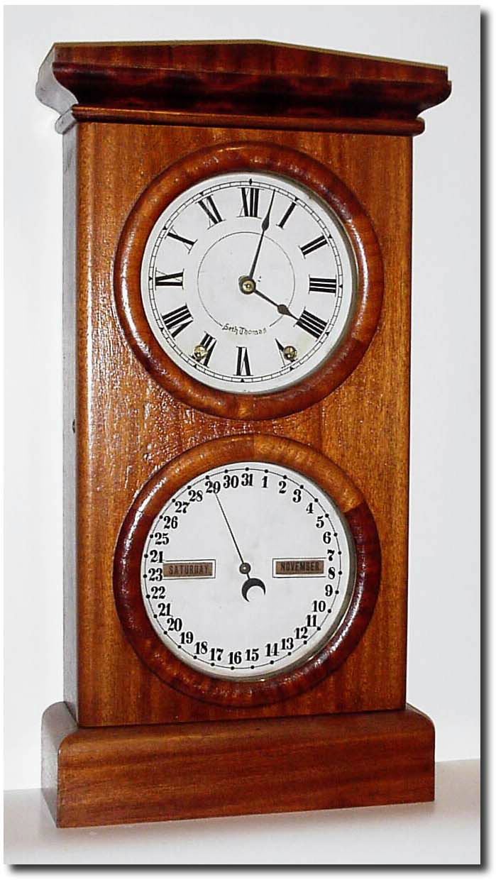 C.1880, Seth Thomas, "Parlor No. 3' perpetual calendar clock with time dial at top and lower dial with day, date and month. — Antique Clocks Price Guide