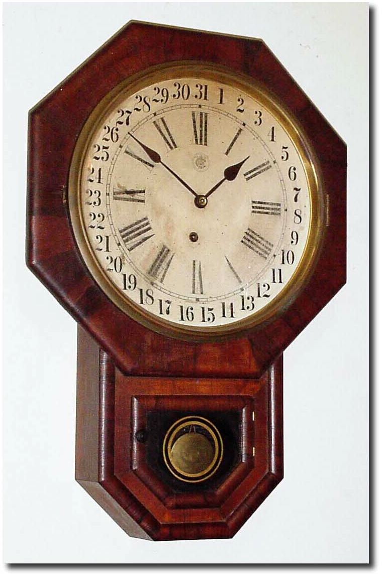 C.1905, Waterbury Clock Co., "12-Inch Octagon Drop R.C.' with calendar, in rosewood. — Antique Clocks Price Guide