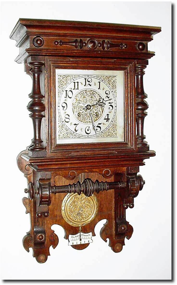 C.1900, Mixed lot: German open well oak case with a married movement, extra holes in the back board and the dial soldered on to the dial feet improperly. — Antique Clocks Price Guide
