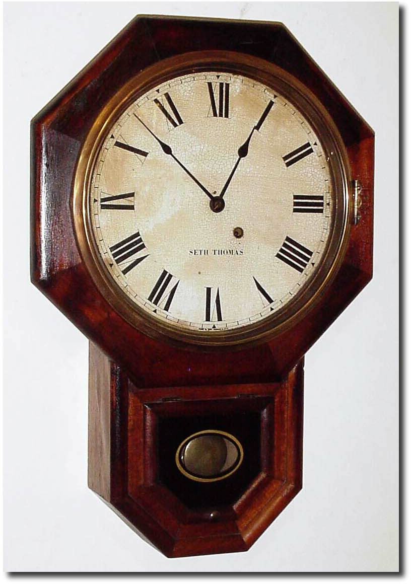 C.1918 (dated on rear), Seth Thomas, Octagon short drop in walnut. — Antique Clocks Price Guide