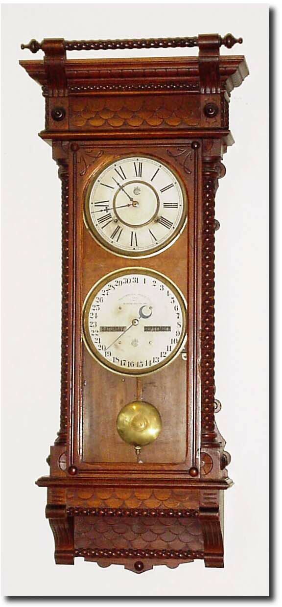 C.1891, Waterbury, "Calendar No. 28', in oak, and in excellent original condition with two rear labels and interior black label. — Antique Clocks Price Guide