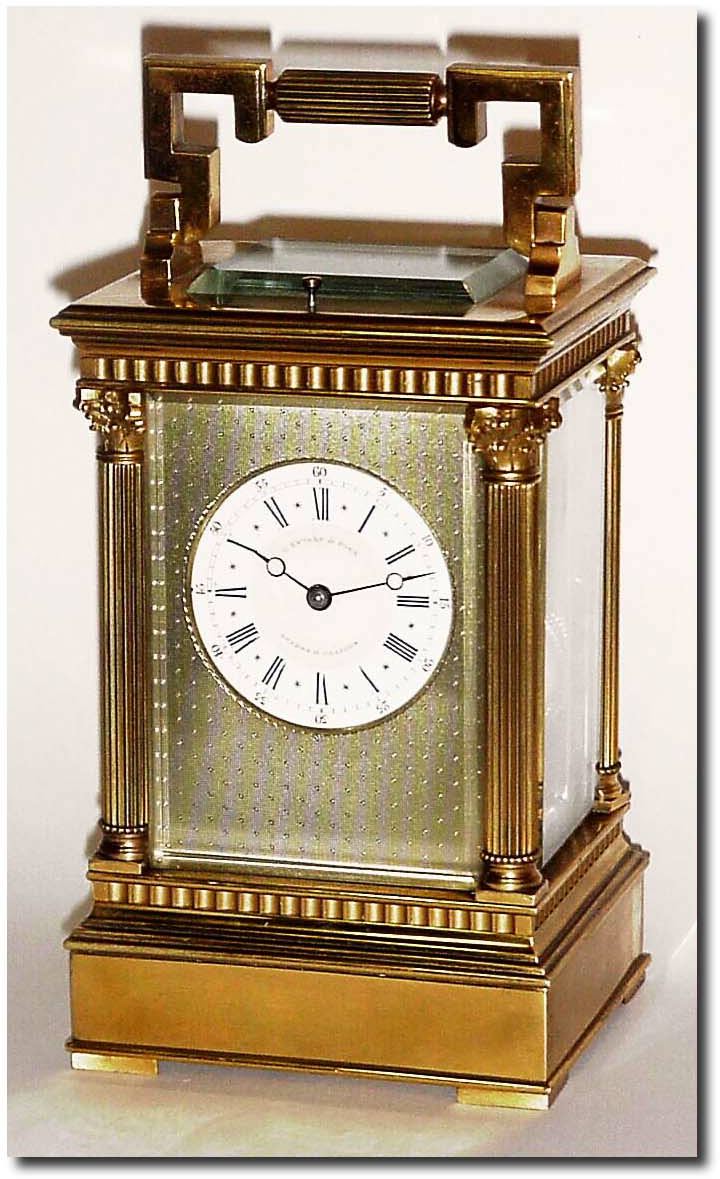 C.1900, French, Brass Cased Carriage Clock time, strike, repeat and alarm, in a classic Anglais Riche case with fluted Corinthian columns and fluted handle. — Antique Clocks Price Guide