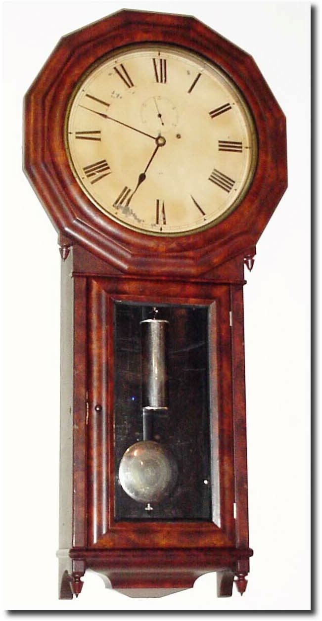 C.1890, Seth Thomas, "Regulator No. 3' in walnut, in very good to excellent original condition. The top bezel veneer has some splits and cracks on the right side (not too bad), the iron movement bracket is now in with machine screws, and dial support stick is new. — Antique Clocks Price Guide