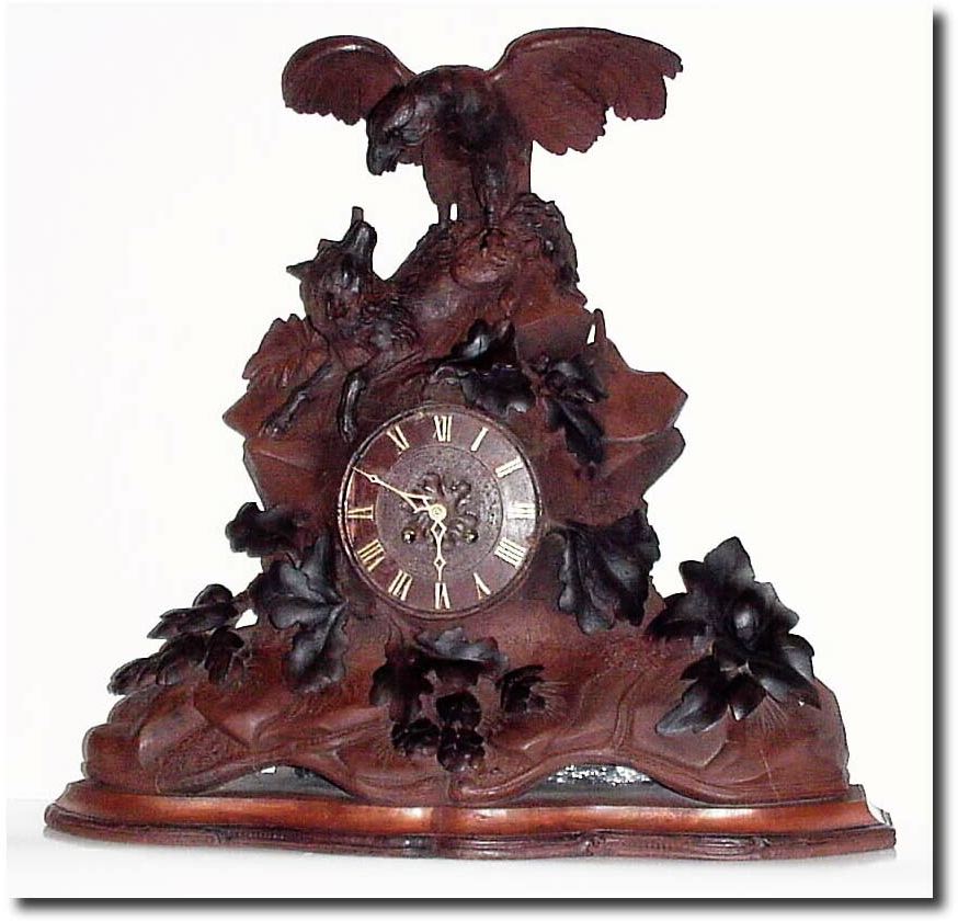 C.1880, Swiss for the French market, a carved figural clock, showing an eagle attacking a wolf. — Antique Clocks Price Guide