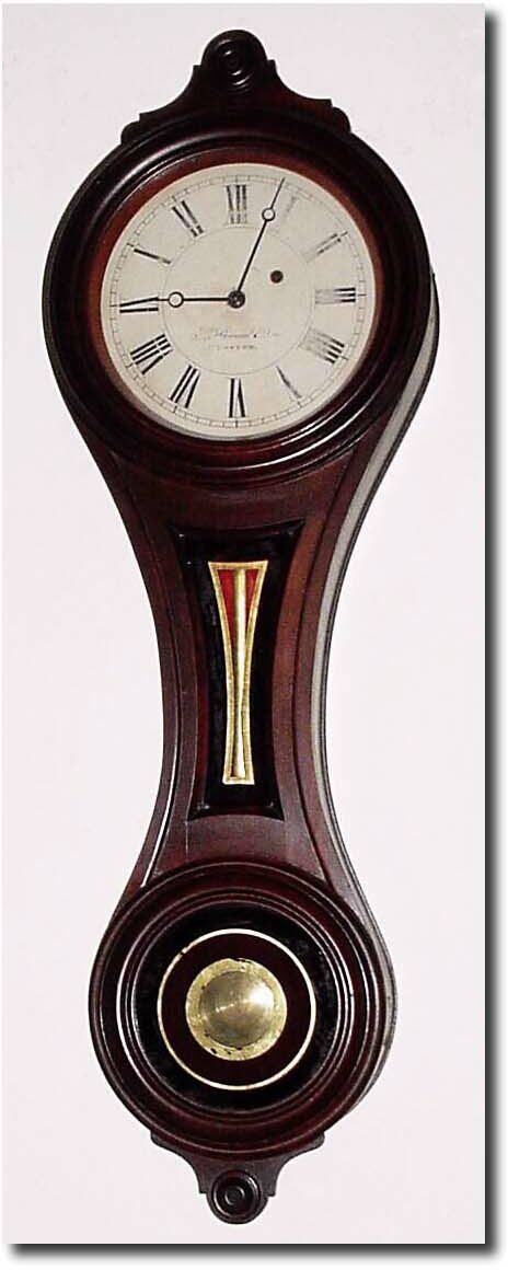 C.1890, E. Howard and Co., "Regulator No. 9' Figure 8, walnut wall clock in very good to excellent original condition. — Antique Clocks Price Guide