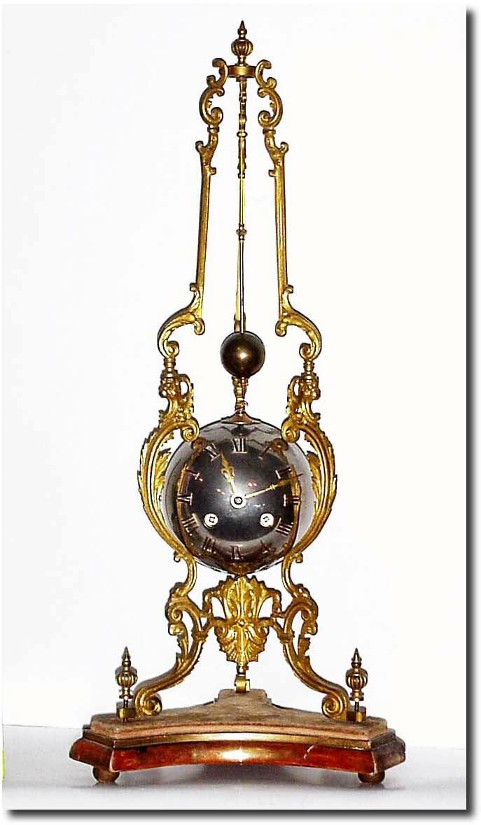 C.1890, French, Large Striking Conical clock, the silvered ball held in a tripod of 3 ormolu legs which rise to an apex from which the conical ball pendulum is suspended. — Antique Clocks Price Guide