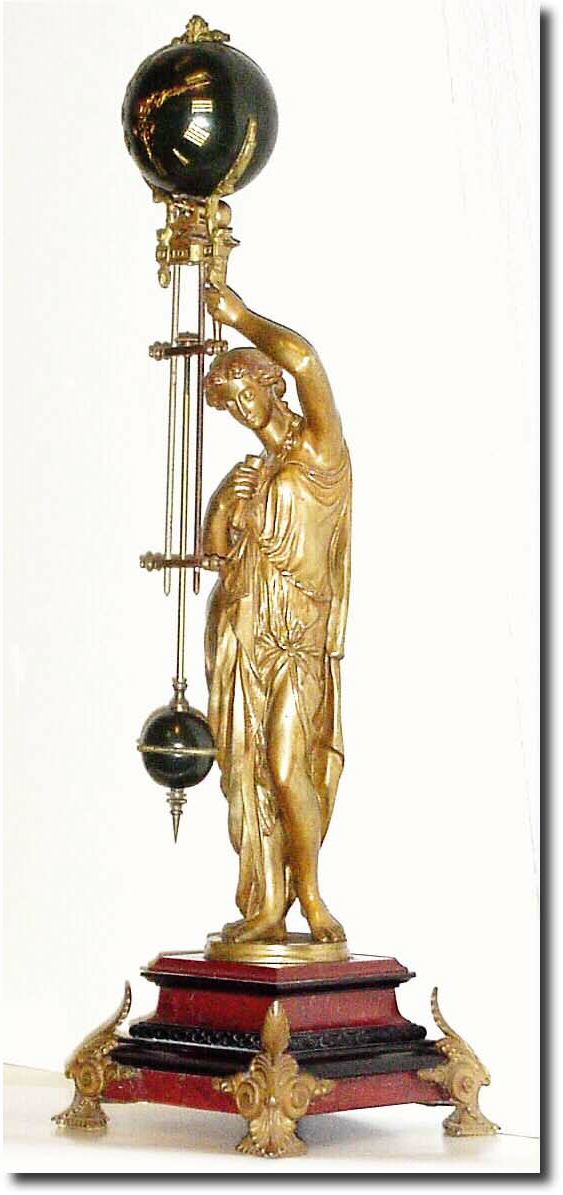 C.1885, French, Gilded Bronze Swinging Mystery Timepiece on a rectangular two color marble base (red and black), with ormolu feet. — Antique Clocks Price Guide