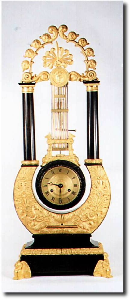 C.1850, French, Lyre form Pendule, the movement within the pendulum, and oscillating back and forth with each tick. — Antique Clocks Price Guide