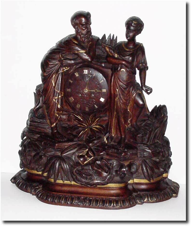 C.1880, Swiss for the French market, a carved walnut figural clock of exceptional quality. — Antique Clocks Price Guide