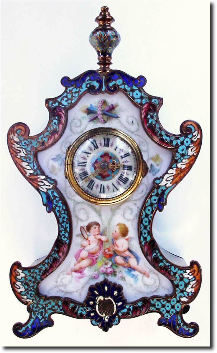 C.1880, French, Small Cloisonne Clock with porcelain panel front, two loving cherubs with a jewelry box and mirror, admiring themselves. — Antique Clocks Price Guide