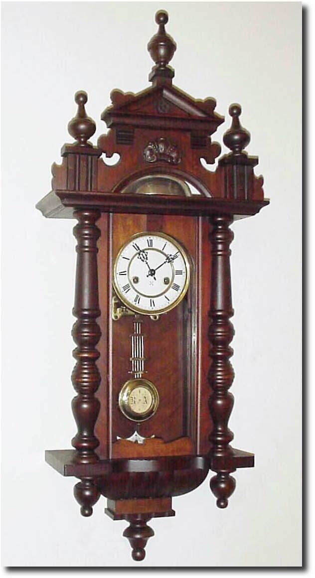 C.1900, German, Hamburg American Clock Co., an unusual "R-A' type wall regulator, with a large bell on top the case, on which the clock actually strikes. — Antique Clocks Price Guide