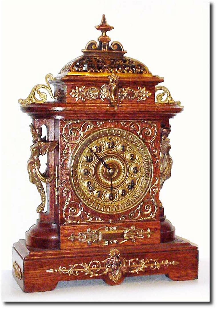 C.1894, Ansonia Clock Co., "Cabinet E', in antique oak with brass trimmings. — Antique Clocks Price Guide
