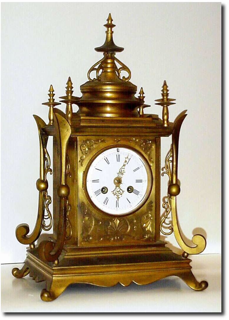 C.1890, French, Architectural form, all ormolu clock, in interesting temple motif, with profusely engraved case. — Antique Clocks Price Guide