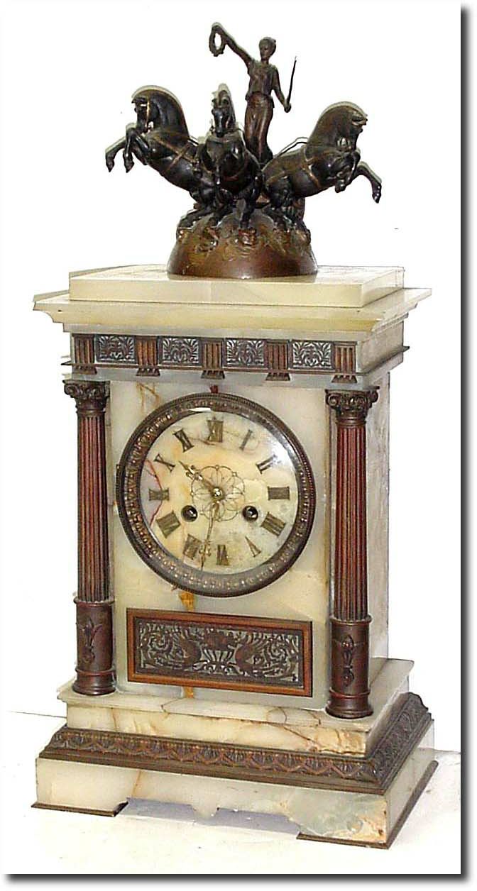 C.1880, French, Marble and Bronze Clock, in classic Roman motif, a female warrior driving a chariot pulled by 3 horses. — Antique Clocks Price Guide