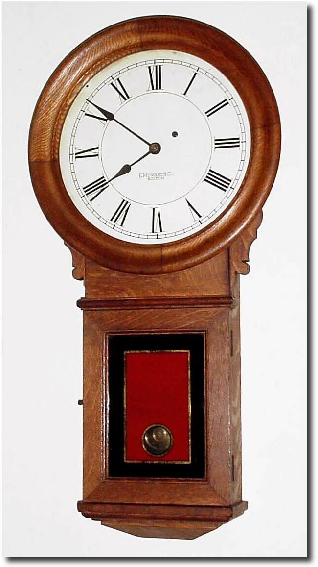 C.1900, E. Howard and Co., Boston, "Regulator No. 70', in oak, refinished and with a cardboard weight baffle that should be changed to wood. — Antique Clocks Price Guide