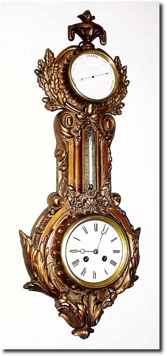 C.1890, French, Clock and Barometer, in a gilded cast iron case with scrolls, flowers, oak leaves with acorns at top, and acanthus leaves at the base. — Antique Clocks Price Guide