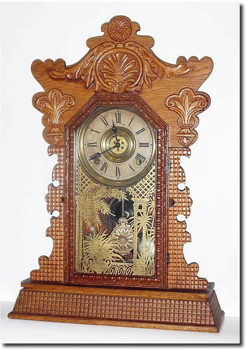 C.1896, E. Ingraham and Co, Pressed Oak gingerbread clock. — Antique Clocks Price Guide