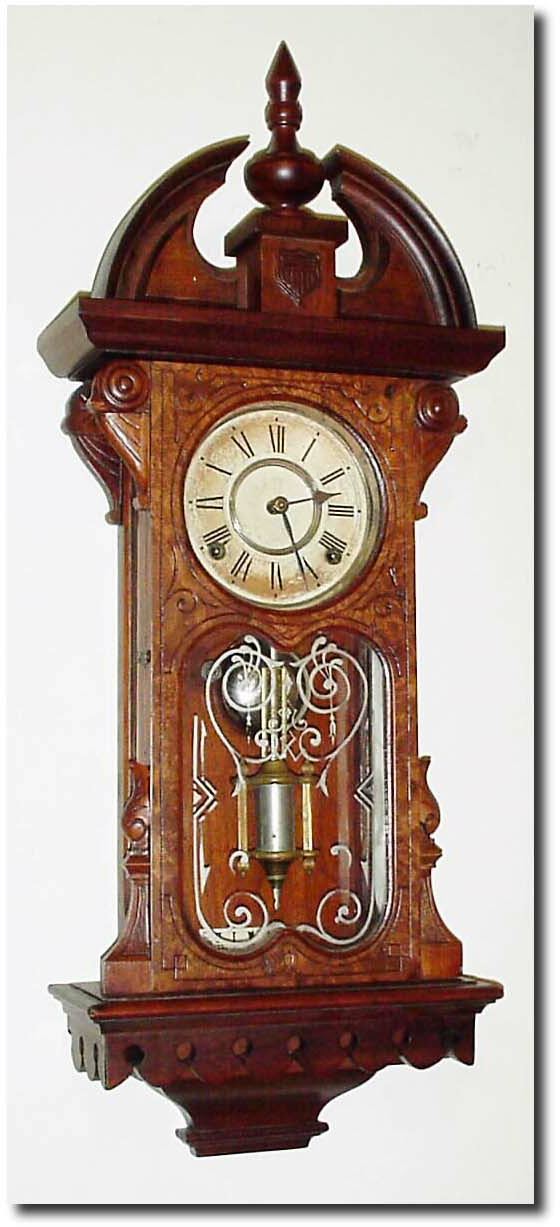 C.1881, Wm.L. Gilbert "Shield', Walnut wall clock, 8-day, time and strike, with restorations. — Antique Clocks Price Guide