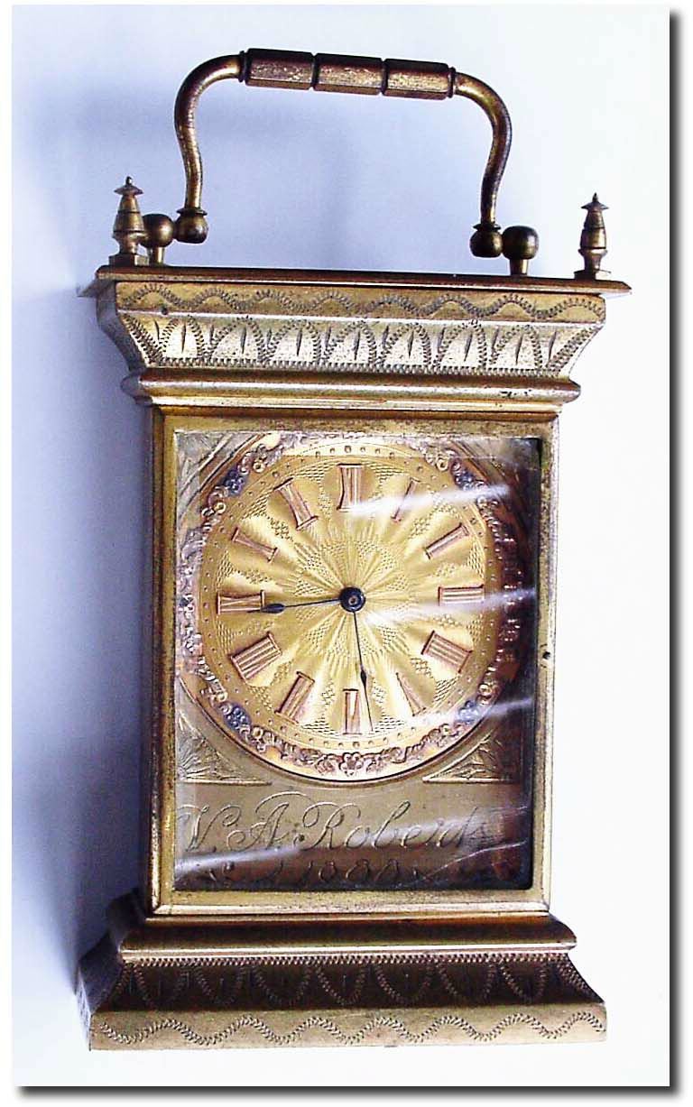 C.1890 (dated), English brass cased sedan clock, the case made as a gift to W. A. Roberts, and signed on the rear by the maker, one B. F. Baird. — Antique Clocks Price Guide