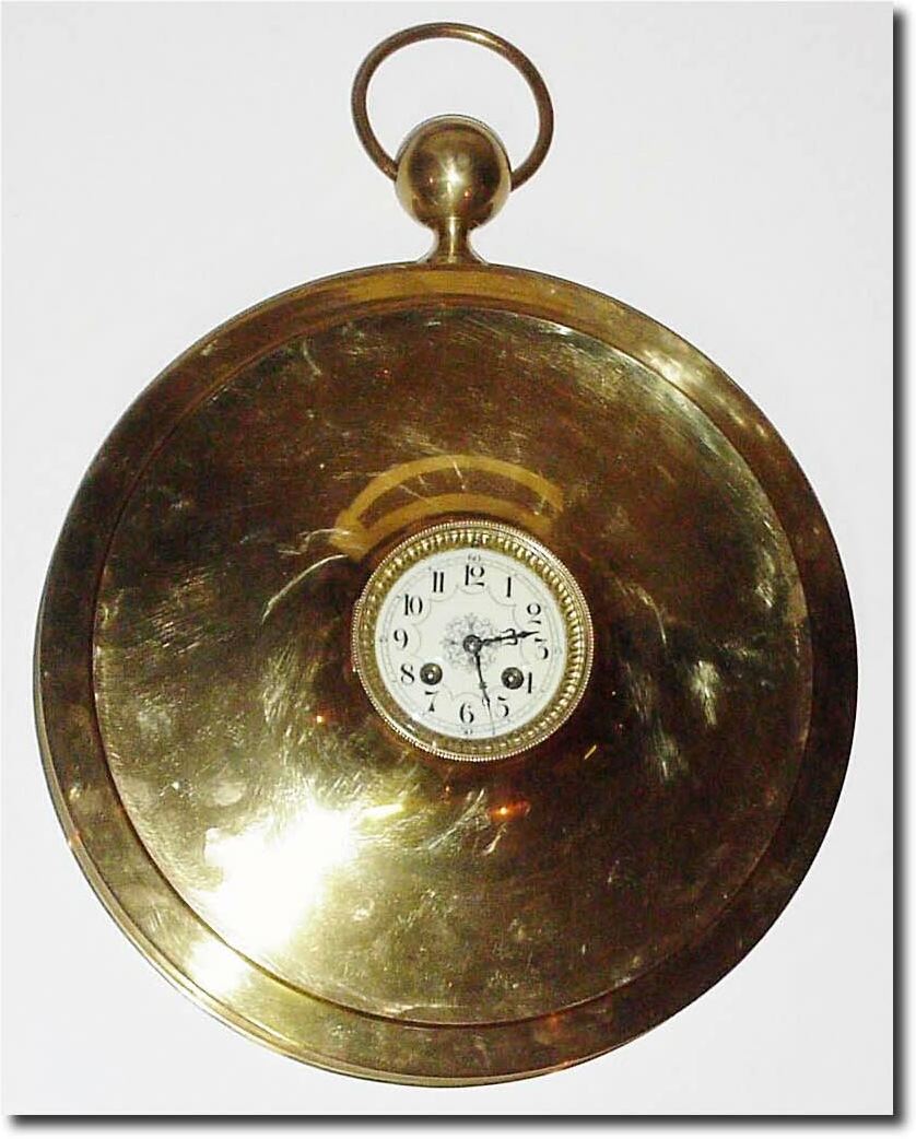 C.1890, French, a large round brass cased wall clock, similar to a watch case, with a normal 4' dial and movement. — Antique Clocks Price Guide