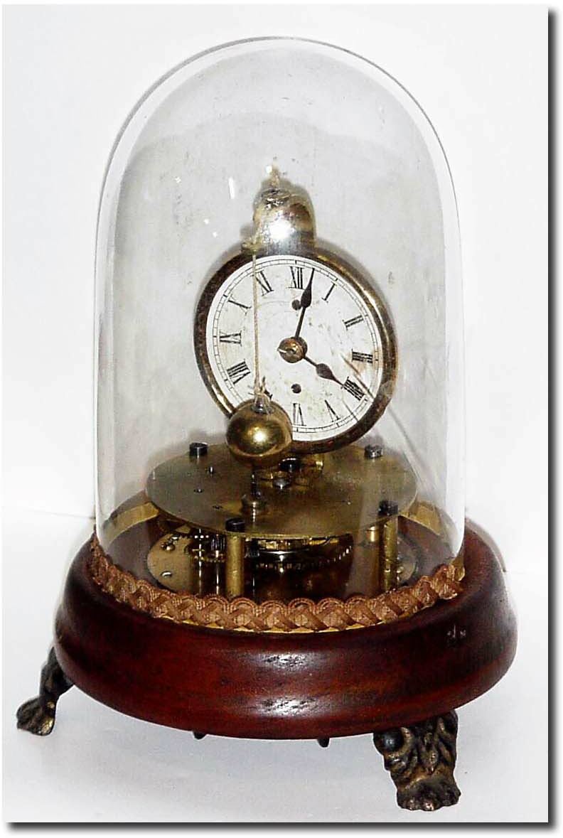C.1875, Another Welch version of the Briggs rotary timepiece, with original glass dome. — Antique Clocks Price Guide
