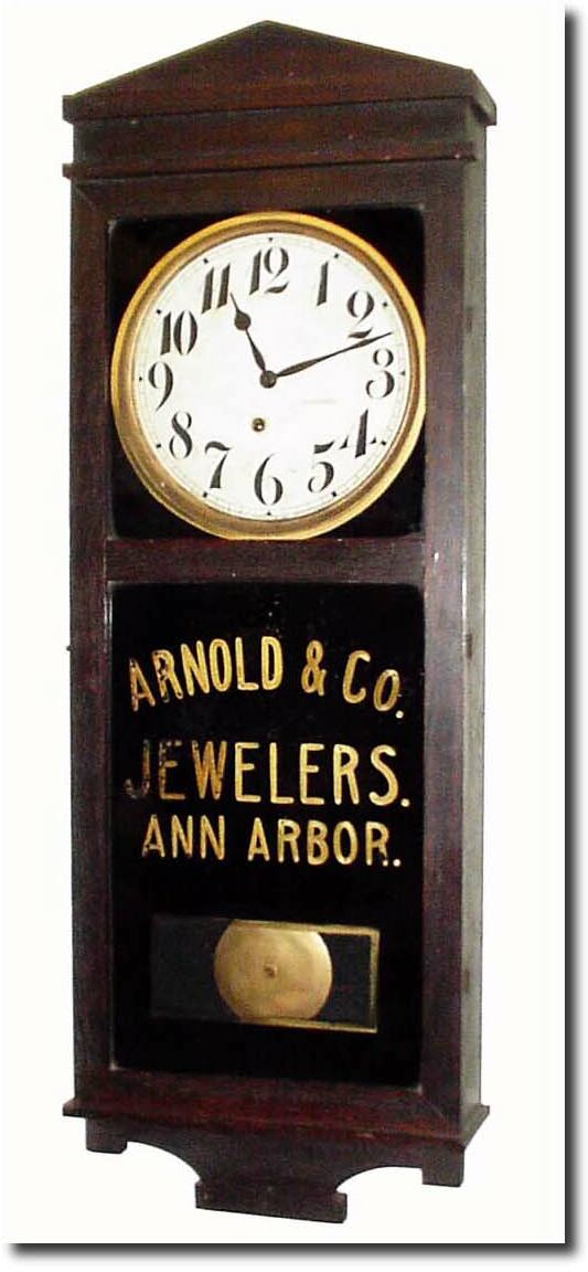 C.1925, E. Ingraham and Co., "Landau' wall clock with original advertising for:"Arnold and Co., Jewelers, Ann Arbor' (paint starting to flake). — Antique Clocks Price Guide