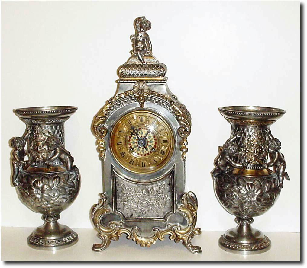 C.1900, French, a 3-Piece Mantel Set, Silver and gold over spelter, and in good original condition. — Antique Clocks Price Guide