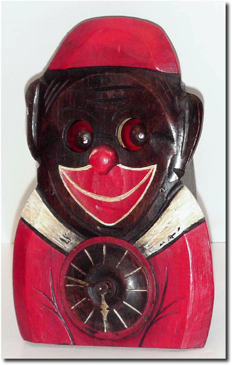 C.1920, German, Black Man Clock, with eyes that rotate (as if to look around the room) while running. — Antique Clocks Price Guide