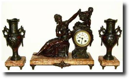 C.1900, French, "LE RAISIN", figural clock set with side garnitures. — Antique Clocks Price Guide