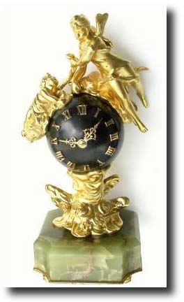 C.1870, French, in the style of Louis XIV, a miniature ormolu and bronze figural clock — Antique Clocks Price Guide