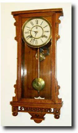 C.1891, Waterbury "Bruce" Oak Cased wall clock. — Antique Clocks Price Guide