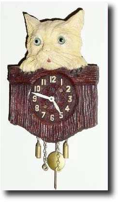 C.1935, Keebler Clock Co., Philadelphia, PA, Kitty Kat Over Fence, novelty clock — Antique Clocks Price Guide