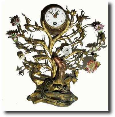 C.1870, French, Miniature Floral display and clock in bronze with porcelain flowers. — Antique Clocks Price Guide